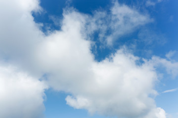 fluffy cloud above blue sky background