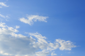 sunlight through cloud on clear blue sky background