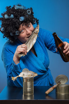 Female alcoholism. Lonely poor fat woman aged drinking beer and