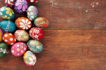Colourful easter eggs old brown wooden board
