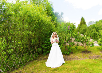 Lovely bride outdoors in a park