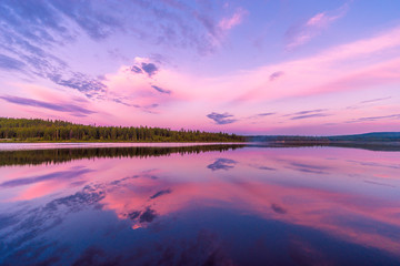 Summer landscape with river, forest, clouds on the blue sky 