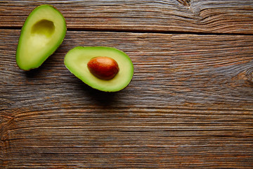 avocado cut on aged wood table board