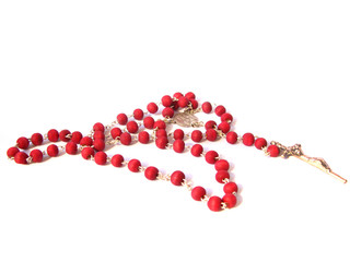 Red rosary made of rose's petals