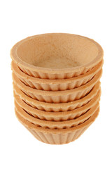 A stack of empty tartlets