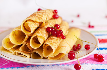 Pancakes with red currants.