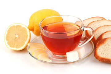 Glass cup of tea with sliced ​​loaf