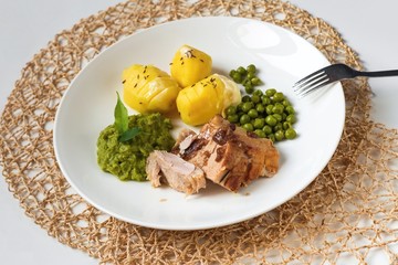 Roasted pork with pea and potato
