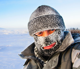 Portrait of a man in a cap and a ski mask. © nordroden
