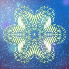 Beautiful abstract blue background with a large flower-snowflake in the center.  flower glows with an inner light. entire background patchy, and has the texture of dots and spots.