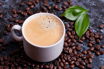 cup of americano on coffee beans background