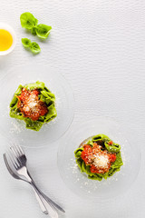 Green Italian Tortellini with Spinach and Ricotta in a plate wit