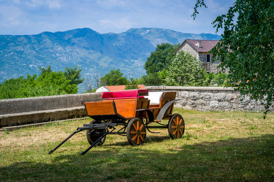Horsedrawn carriage in Ostrog monastery lower church court. Famous monastery in the mountains of Montenegro.