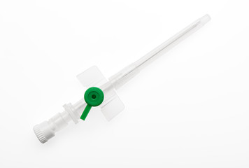 Green plastic catheter with needle closed by protective cap