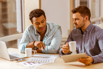 Young handsome businessmen coworking