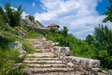 Fototapeta na wymiar Bedem medieval fortress steps to the entrance. Niksic town, Montenegro