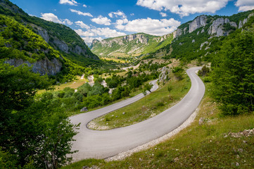 Curved road and beautiful mountain range landscape. Nevidio - invisible canyon, popular touristic spot in Montenegro.