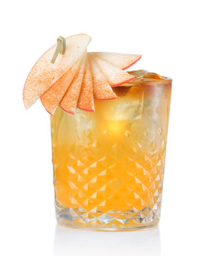 Fruit alcohol cocktail with apple and cinnamon stick isolated
