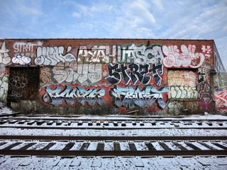 Urban ghetto near Detroit train tracks with blue sky - landscape photo