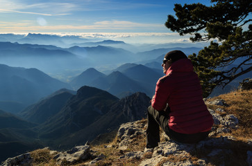 Female hiker enjoying the view from the Vercors plateau, France.