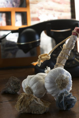 garlic string on wooden commode