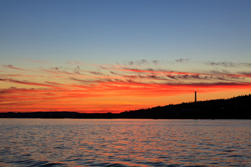 Fototapeta premium Calm sunset and clouds over lake