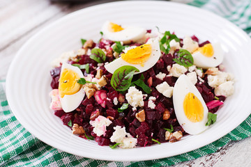 Salad baked beets, feta cheese, eggs, and walnuts