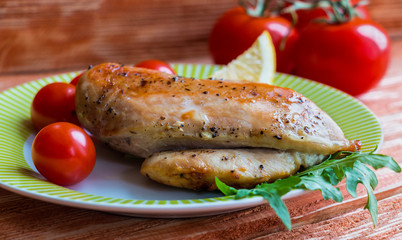 Grilled chicken fillet with fresh tomatoes