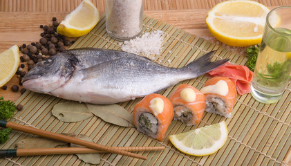  fresh fish with lemon, butter, salt and pepper