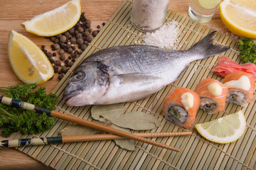  fresh fish with lemon, butter, salt and pepper