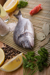  fresh fish with lemon, butter, salt and pepper