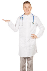 Medical doctor in white coat with stethoscope holding something