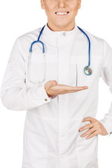 Fototapeta premium Medical doctor in white coat with stethoscope holding something