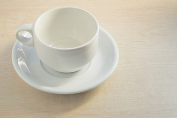 empty cup on wood surface with space
