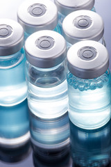  medical ampoules on a black background