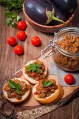 Eggplant caviar in a glass jar with croutons
