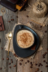 Cup of coffee with coffee beans and chocolate