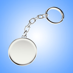 Blank round metal keychain with key ring on blue background