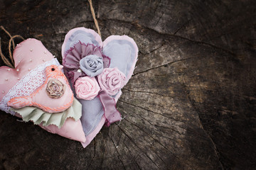 Hand-made hearts  on the old board