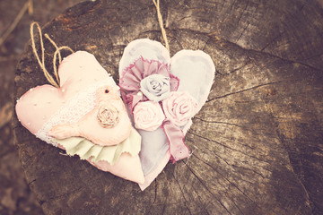 Hand-made hearts  on the old board