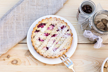 Homemade pie with coffee on a wooden background
