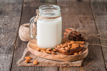 almonds milk in a glass jar with almonds