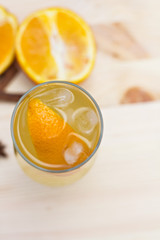 Lemonade with orange and spices on the table