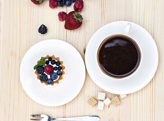 Tart  with Fresh berries - dessert on wooden table close up