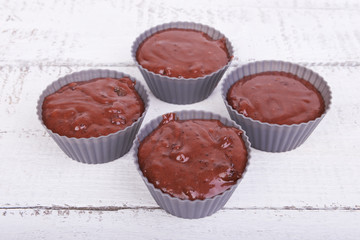 The dough for chocolate cakes muffins in silicone