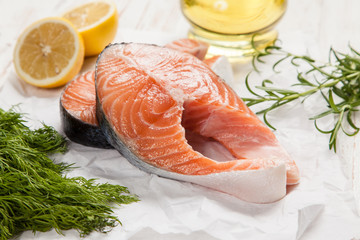 Fresh salmon on white wood