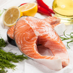 Fresh salmon on white wood