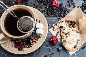 cup of tea and cookies with chocolate