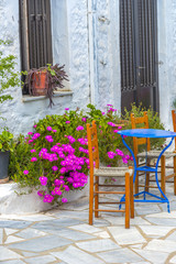 Fototapeta na wymiar Traditional greek tavern in the narrow streets of Mykonos, Greec