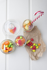Multicolor candies in glass jars